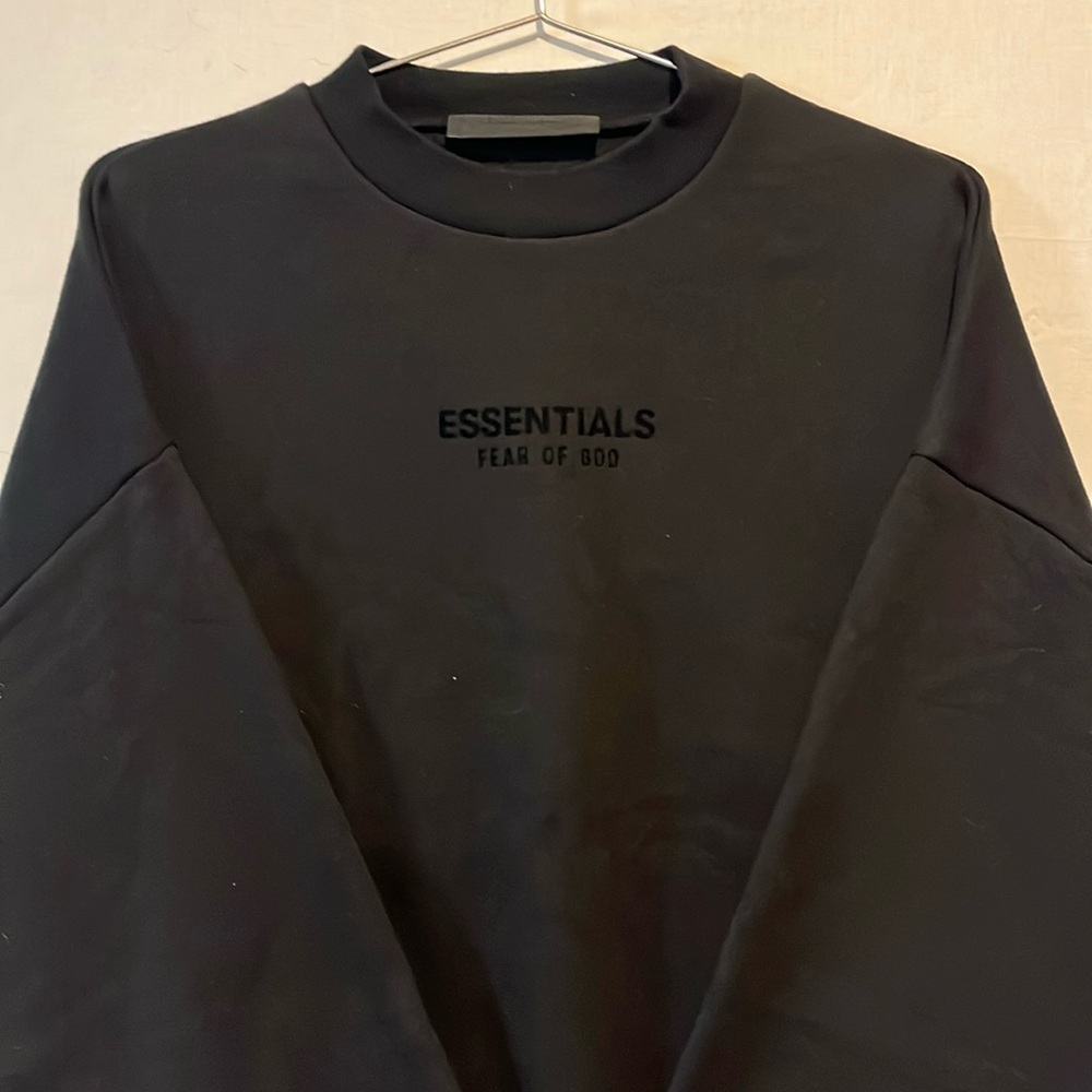 Fear of God ESSENTIALS 
black pullover sweatshirt